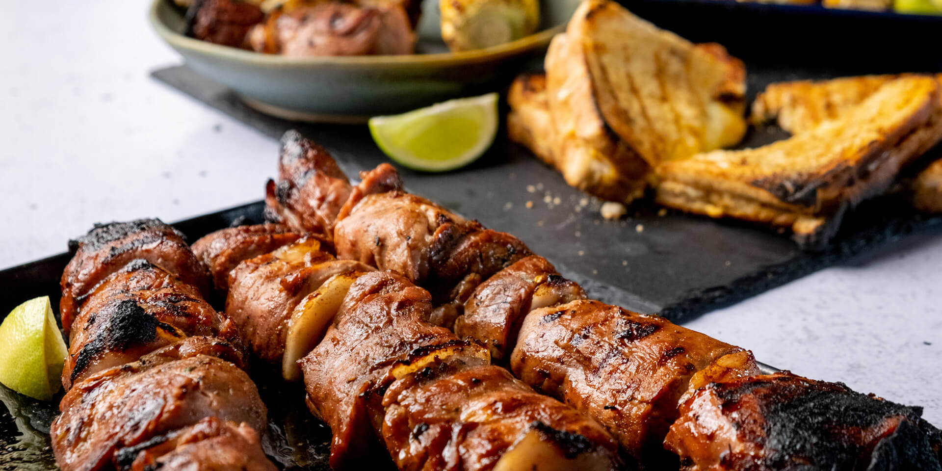 Eskort - Eskort Pork Espetada with Chilli & Lime Buttered Corn & Cheesy Braai Bread - Eskort